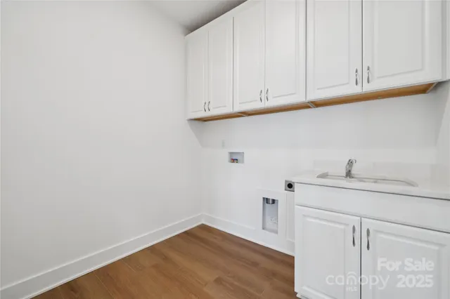 a view of cabinets with wooden floor