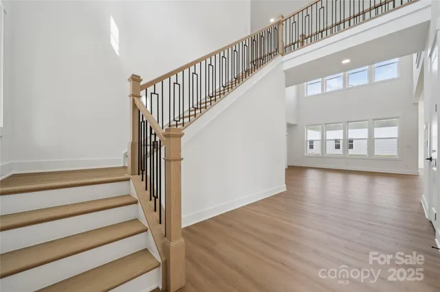 a view of an entryway with wooden floor