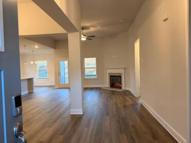 a view of a room with wooden floor