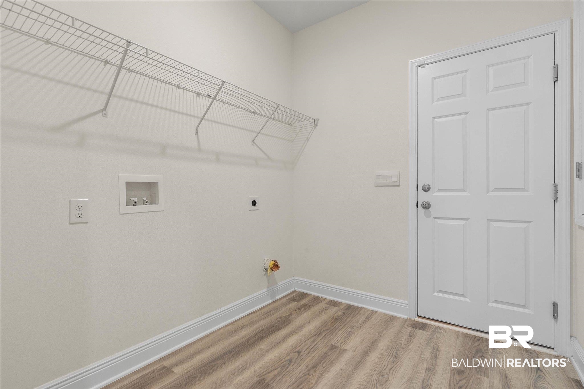 11229 Genuine Risk Circle Daphne, AL 36526 - Photo 23 of 46 Laundry room featuring light wood-type flooring, washer hookup, hookup for an electric dryer, and hookup for a gas dryer