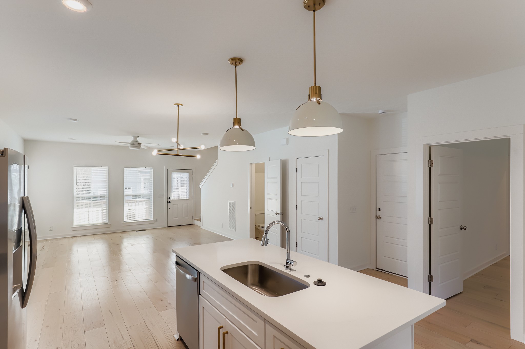 1121 Alcove Way Antioch, TN 37013 - Photo 6 of 25 a kitchen with a sink a refrigerator and wooden floor