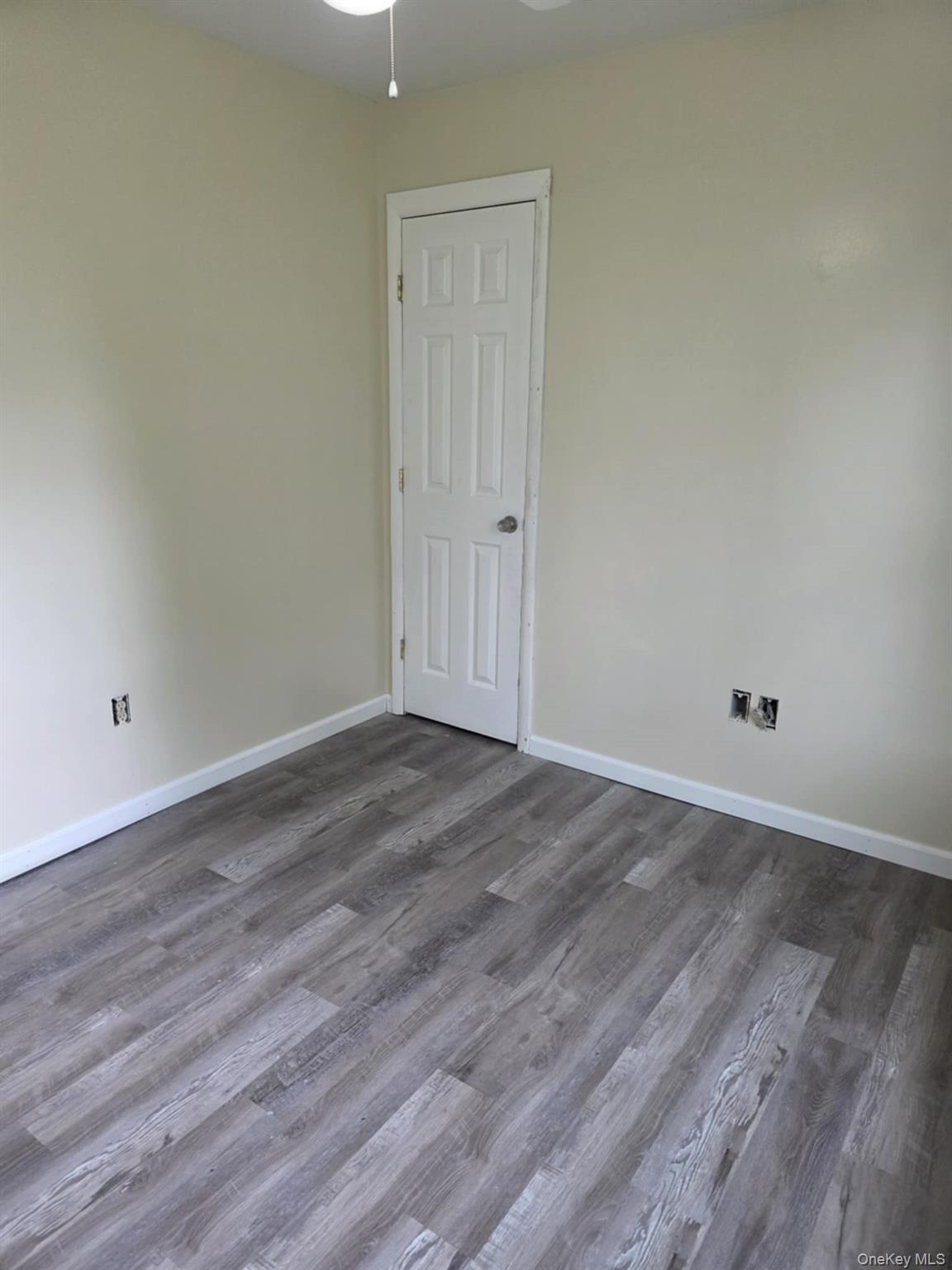 105-107 East Cold Spring Road Monticello, NY 12701 - Photo 21 of 22 Spare room with wood finished floors and ceiling fan