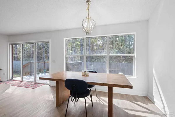 a view of a room with a large window and table