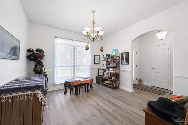 a view of a livingroom with furniture and wooden floor