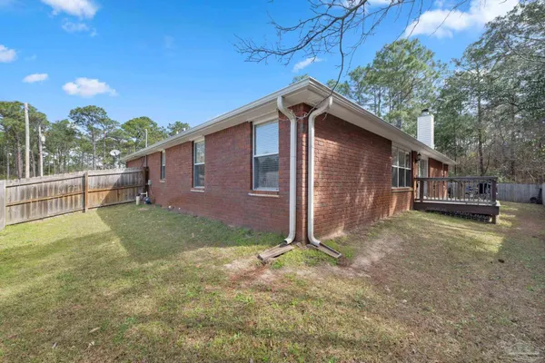 a backyard of a house with lots of green space