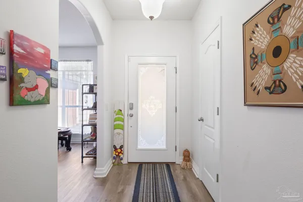 wooden floor view with windows and painting on the wall