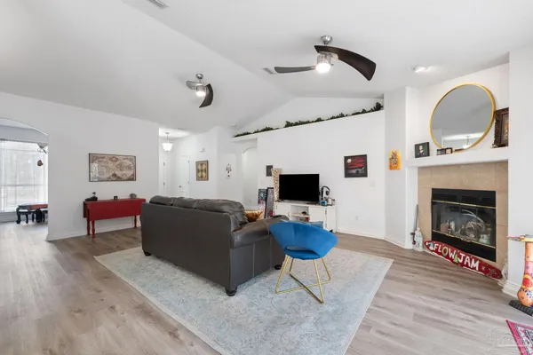 a living room with furniture and a fireplace