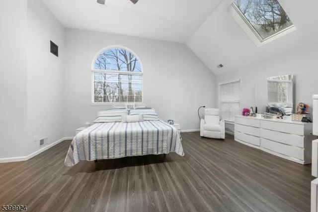 a bed room with a bed and a window