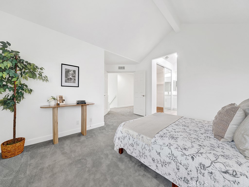 13814 Apache Tustin, CA 92782 - Photo 19 of 45 a spacious bedroom with a bed and a cabinets