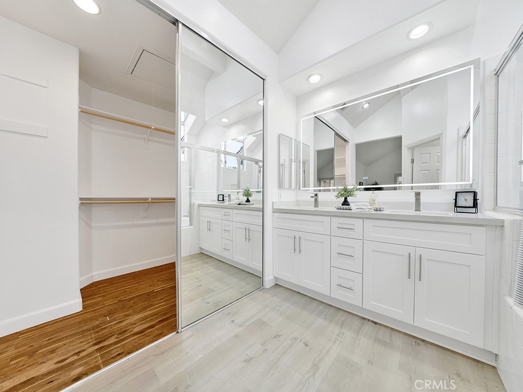 13814 Apache Tustin, CA 92782 - Photo 23 of 45 a bathroom with a sink double vanity and a mirror