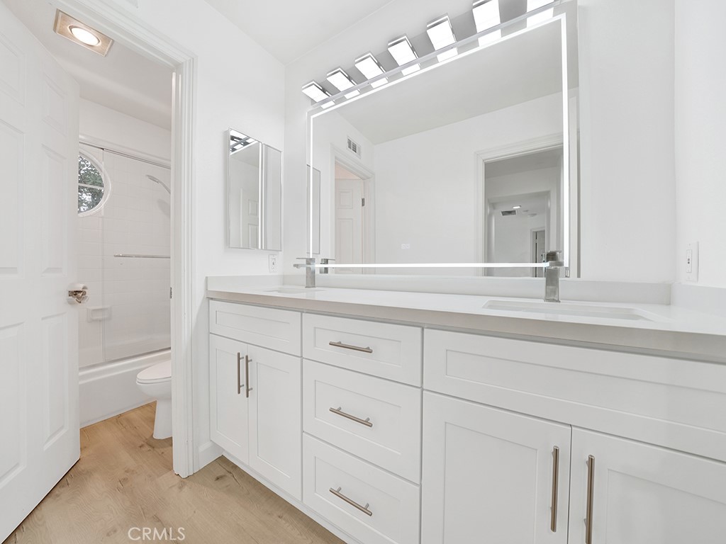 13814 Apache Tustin, CA 92782 - Photo 26 of 45 a bathroom with a sink vanity tub and shower