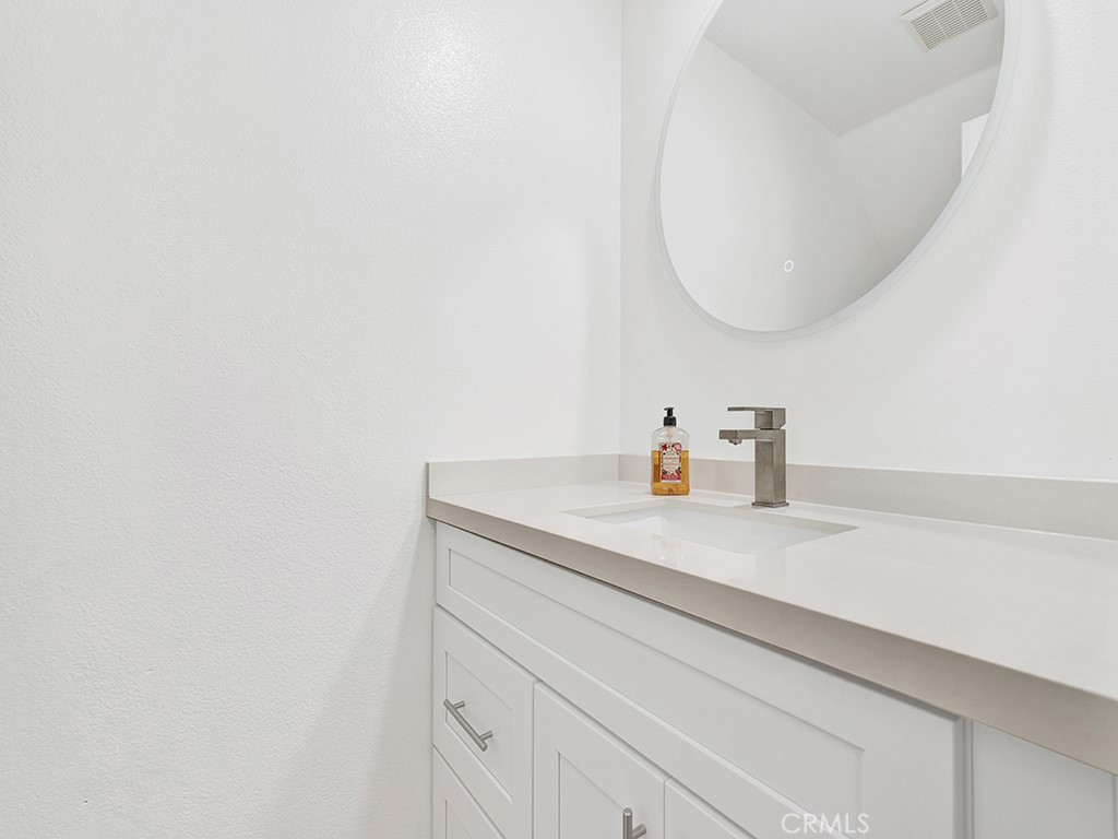 13814 Apache Tustin, CA 92782 - Photo 28 of 45 a bathroom with a sink and a mirror