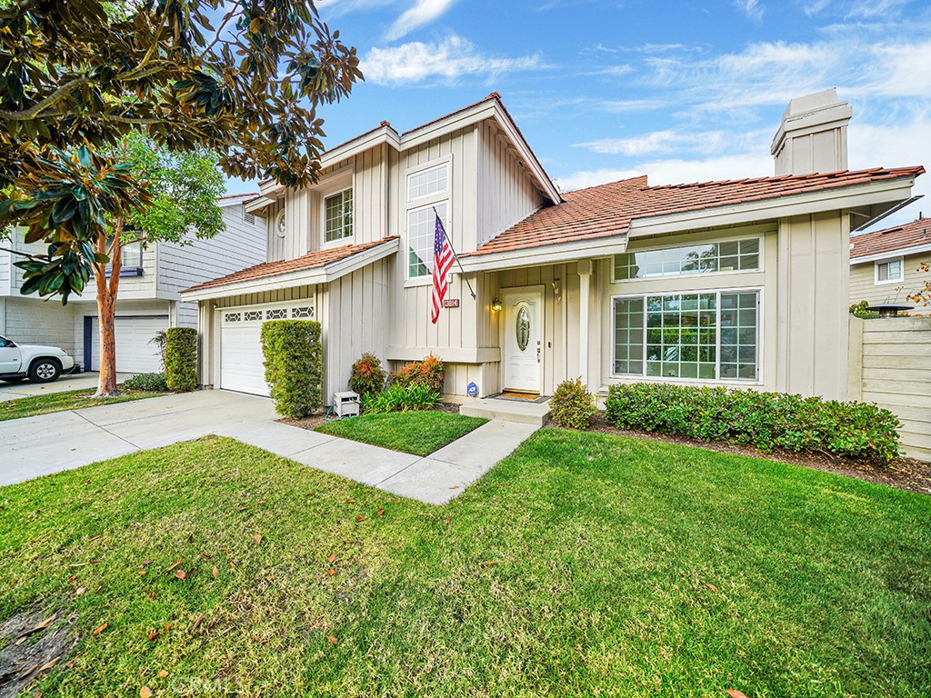 13814 Apache Tustin, CA 92782 - Photo 37 of 45 a front view of a house with a yard