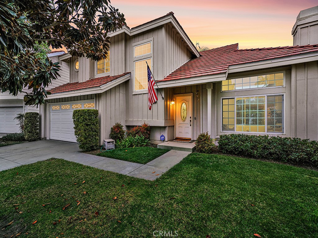 13814 Apache Tustin, CA 92782 - Photo 40 of 45 a front view of a house with a garden