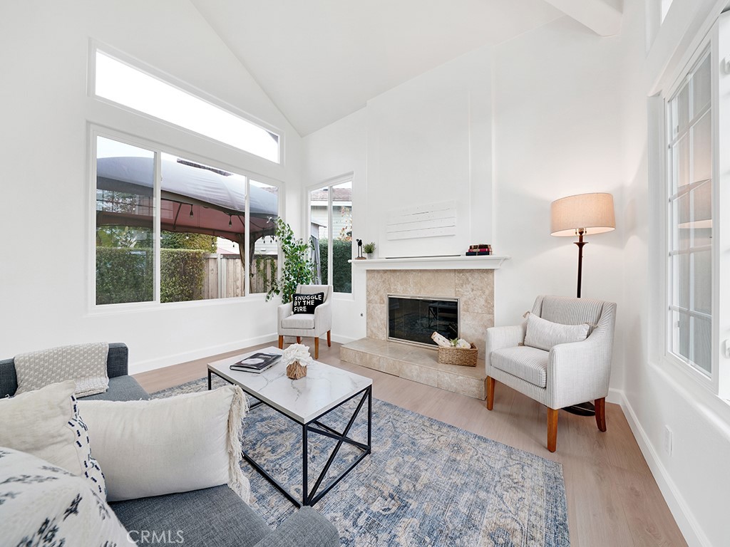 13814 Apache Tustin, CA 92782 - Photo 6 of 45 a living room with furniture a table and a fireplace