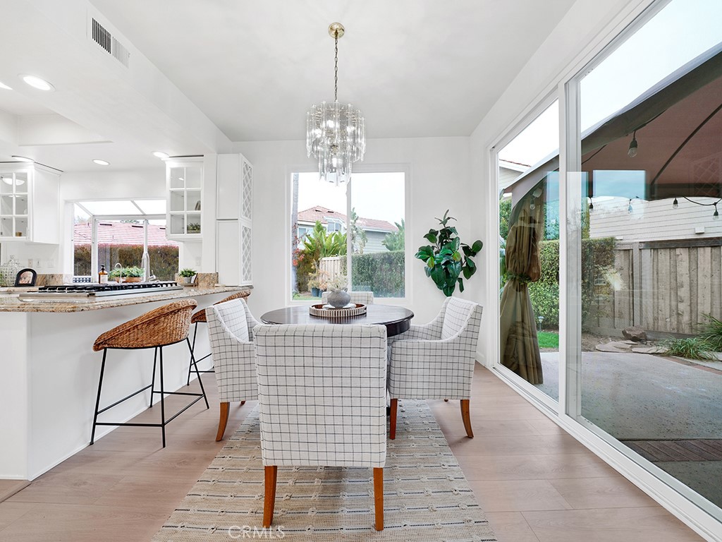 13814 Apache Tustin, CA 92782 - Photo 7 of 45 a living room with furniture and a chandelier