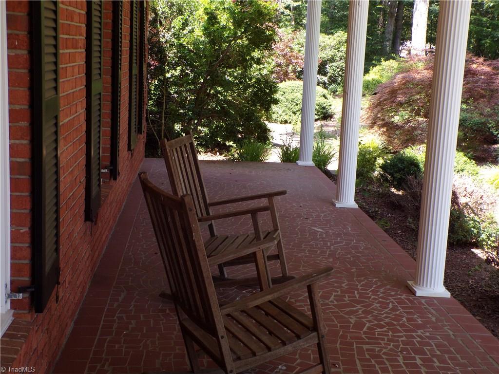 2525 Nebo Road Boonville, NC 27011 - Photo 3 of 30 Rocking chair front porch