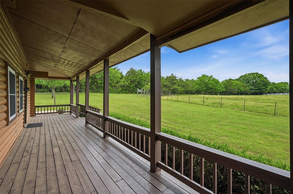570 Ayres Road Bells, TX 75414 - Photo 35 of 40 a view of a wooden deck next to a yard