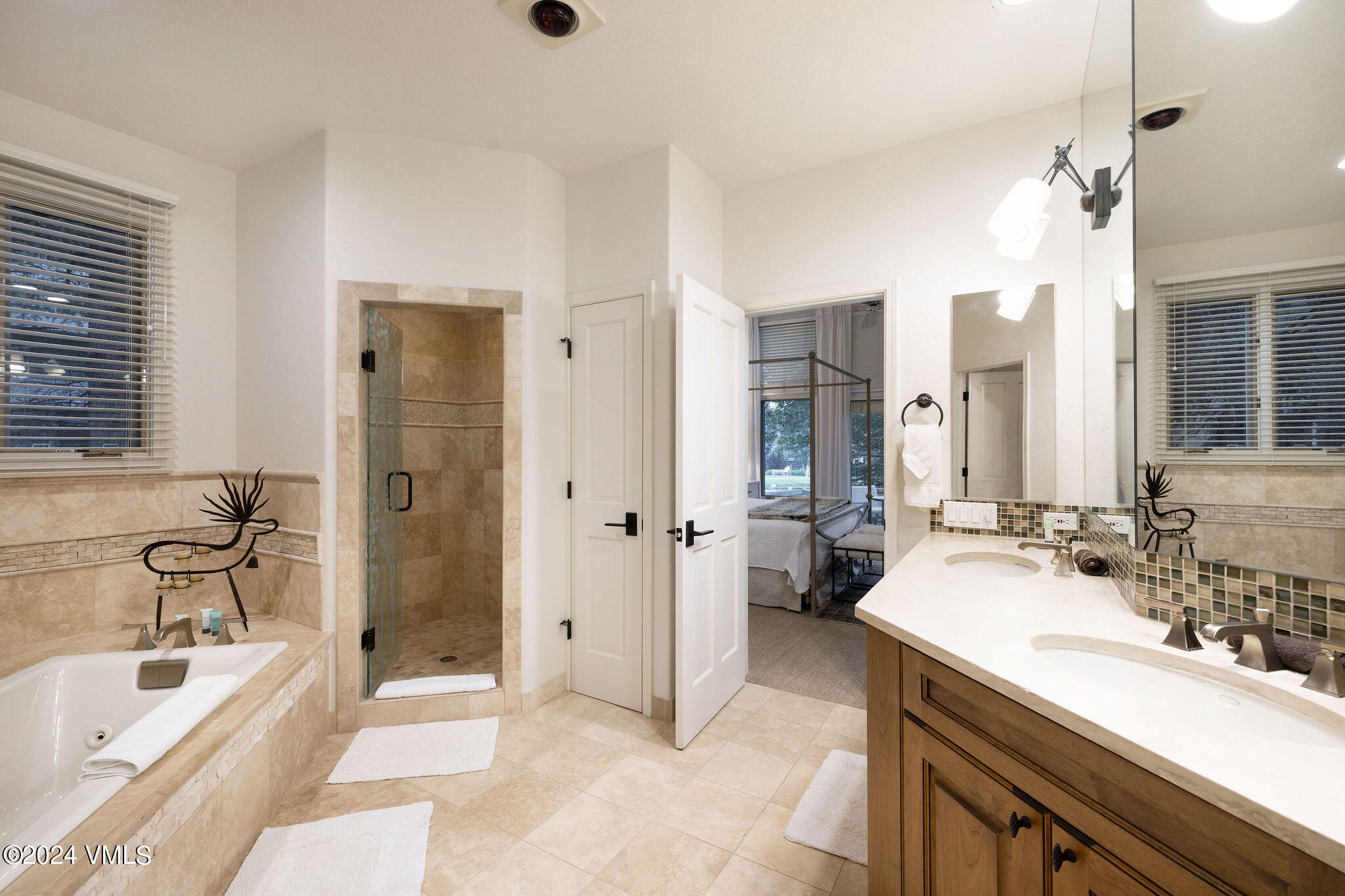 91 Ambleside Place Edwards, CO 81632 - Photo 11 of 28 a spacious bathroom with a tub sink shower and mirror