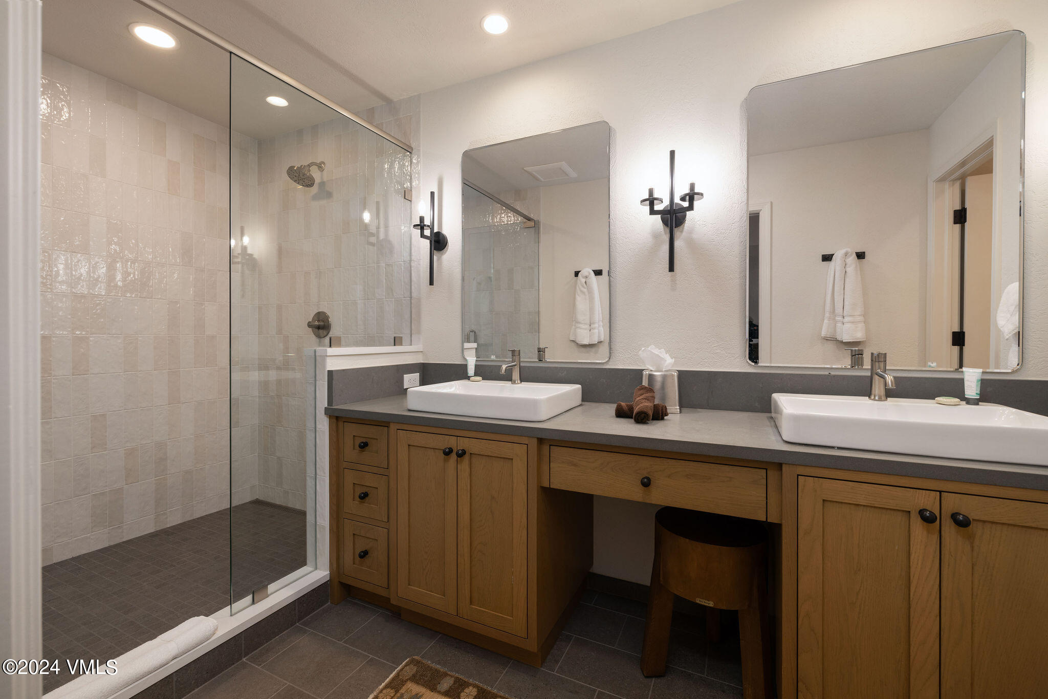 91 Ambleside Place Edwards, CO 81632 - Photo 12 of 28 a bathroom with double sink and a mirror