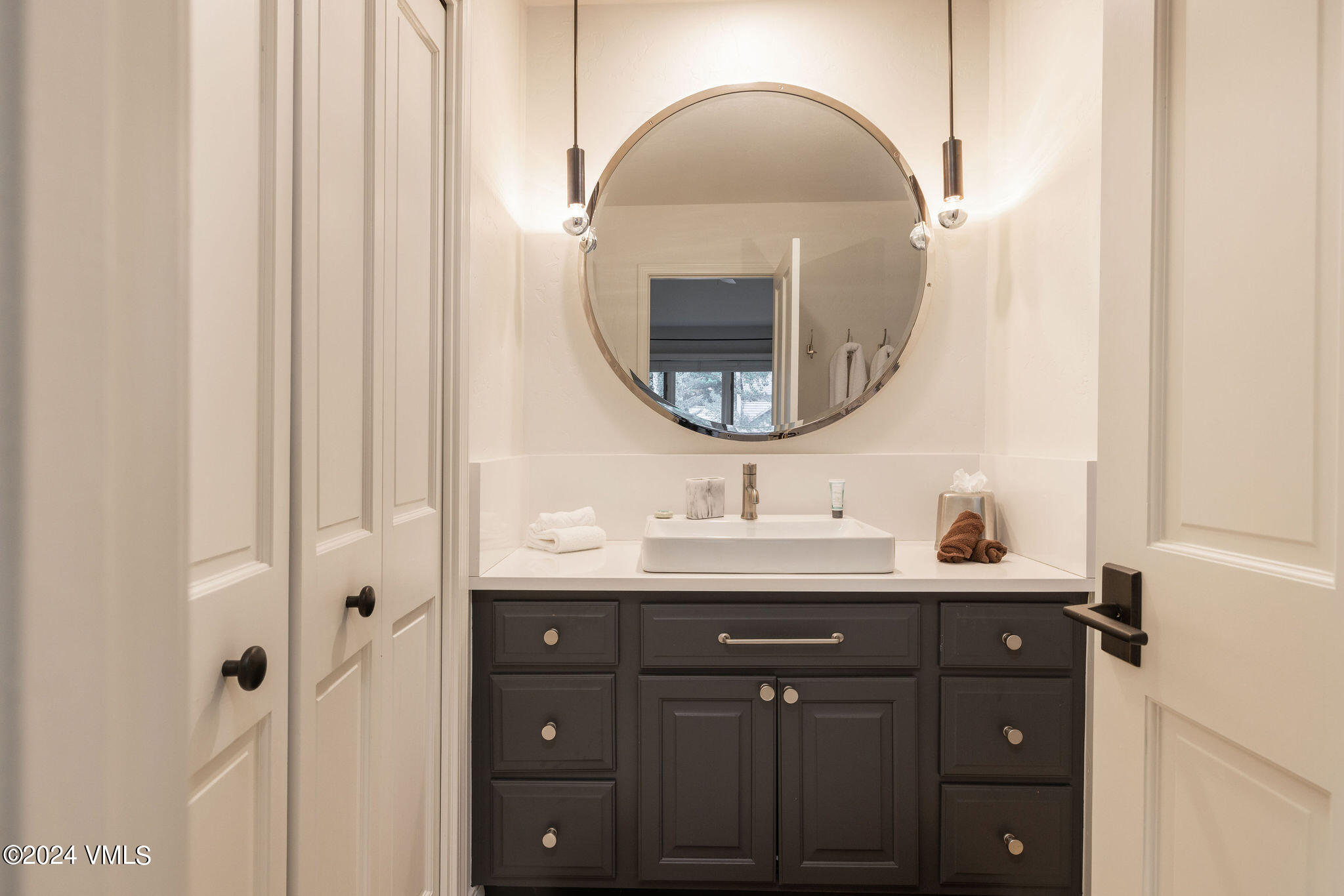 91 Ambleside Place Edwards, CO 81632 - Photo 13 of 28 a bathroom with a double vanity sink and a mirror