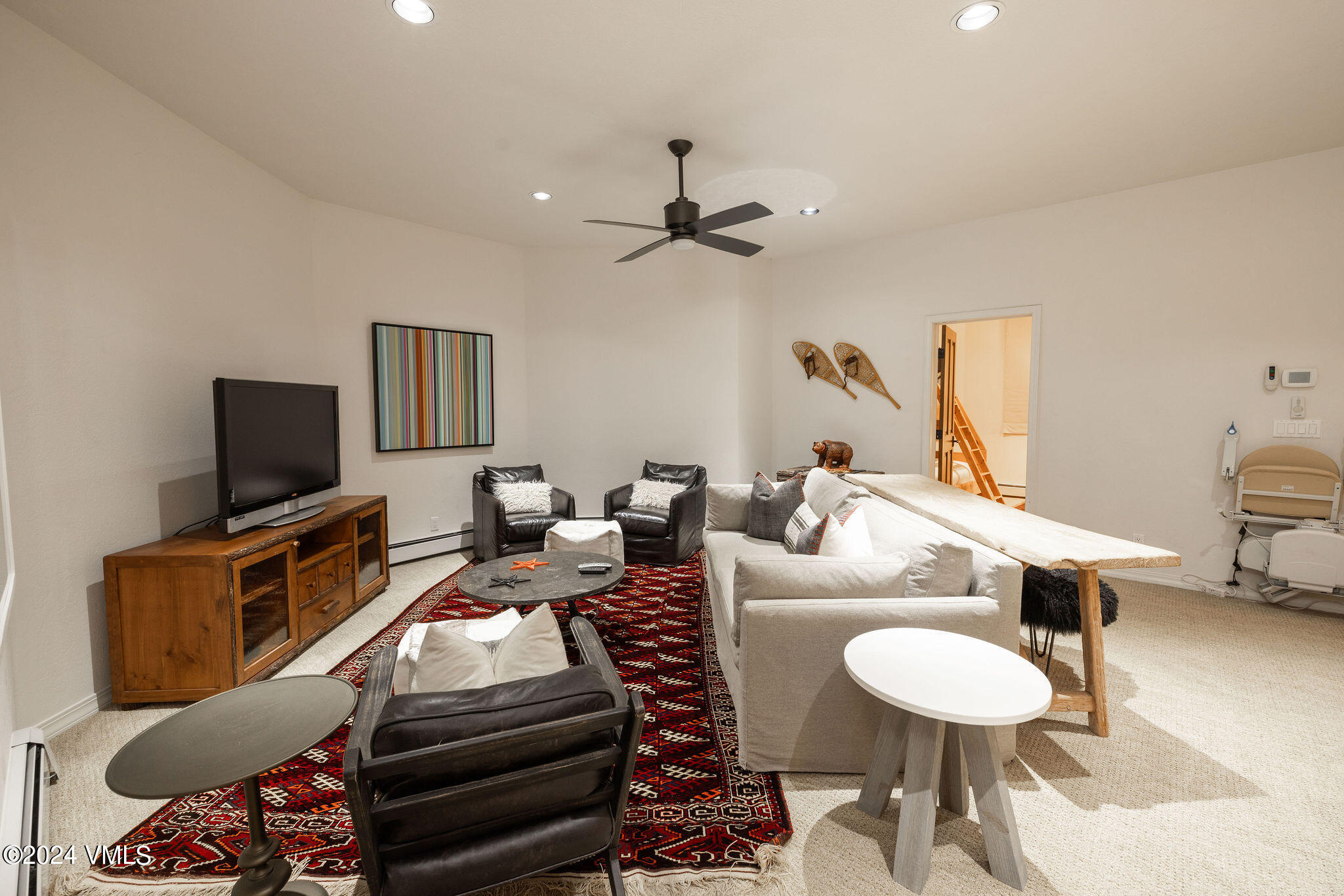 91 Ambleside Place Edwards, CO 81632 - Photo 17 of 28 a living room with furniture a flat screen tv and kitchen view