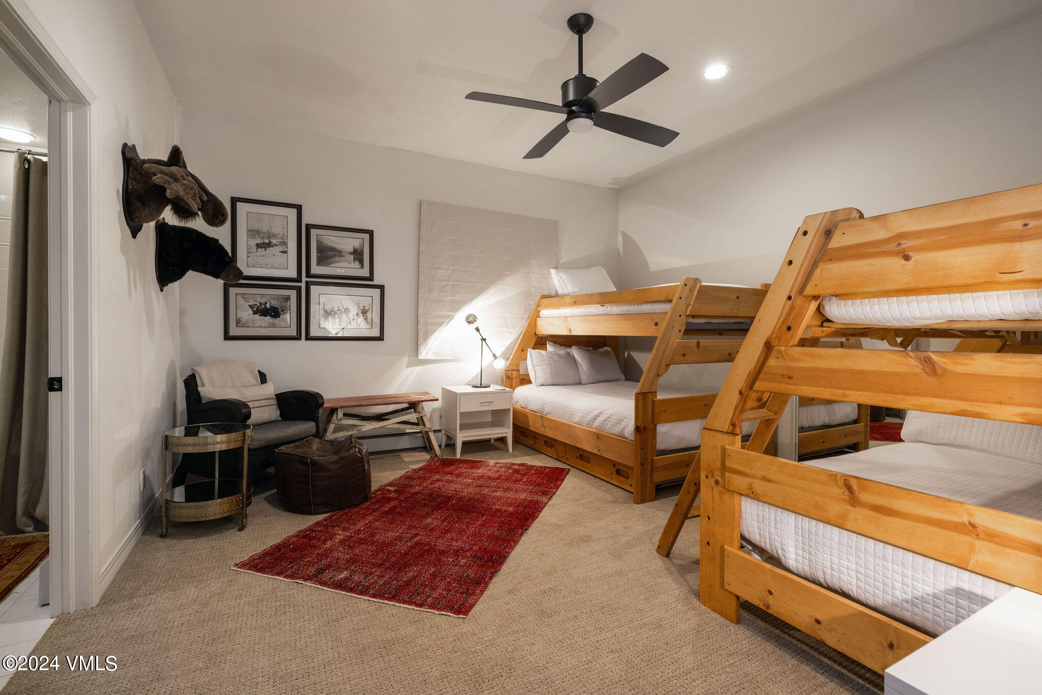 91 Ambleside Place Edwards, CO 81632 - Photo 18 of 28 a bedroom with furniture and a rug