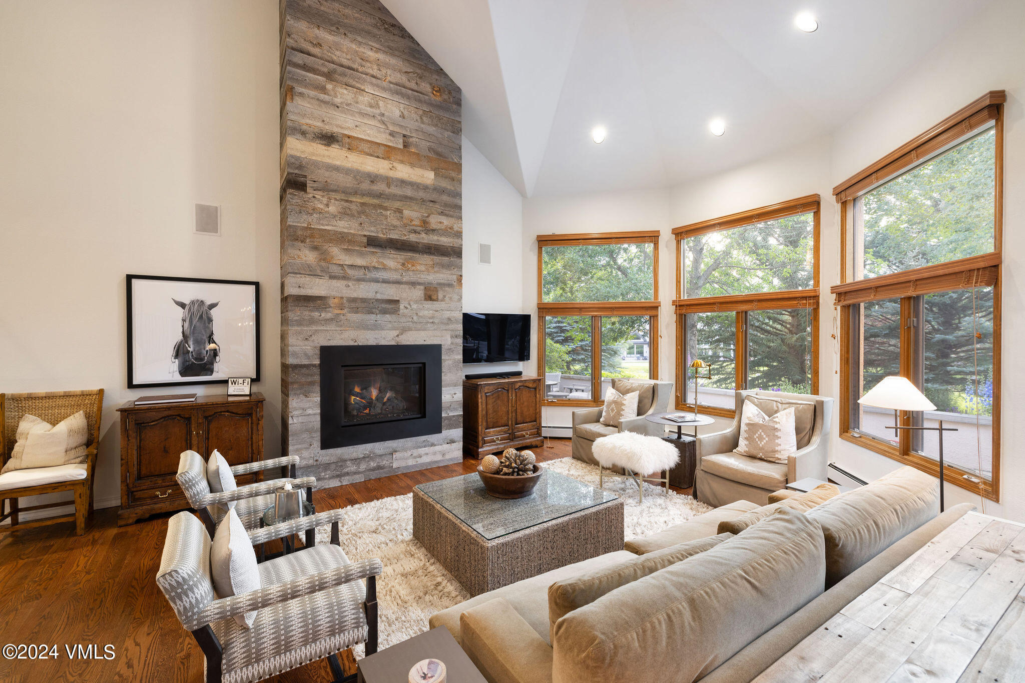 91 Ambleside Place Edwards, CO 81632 - Photo 3 of 28 a living room with furniture large window and a fireplace