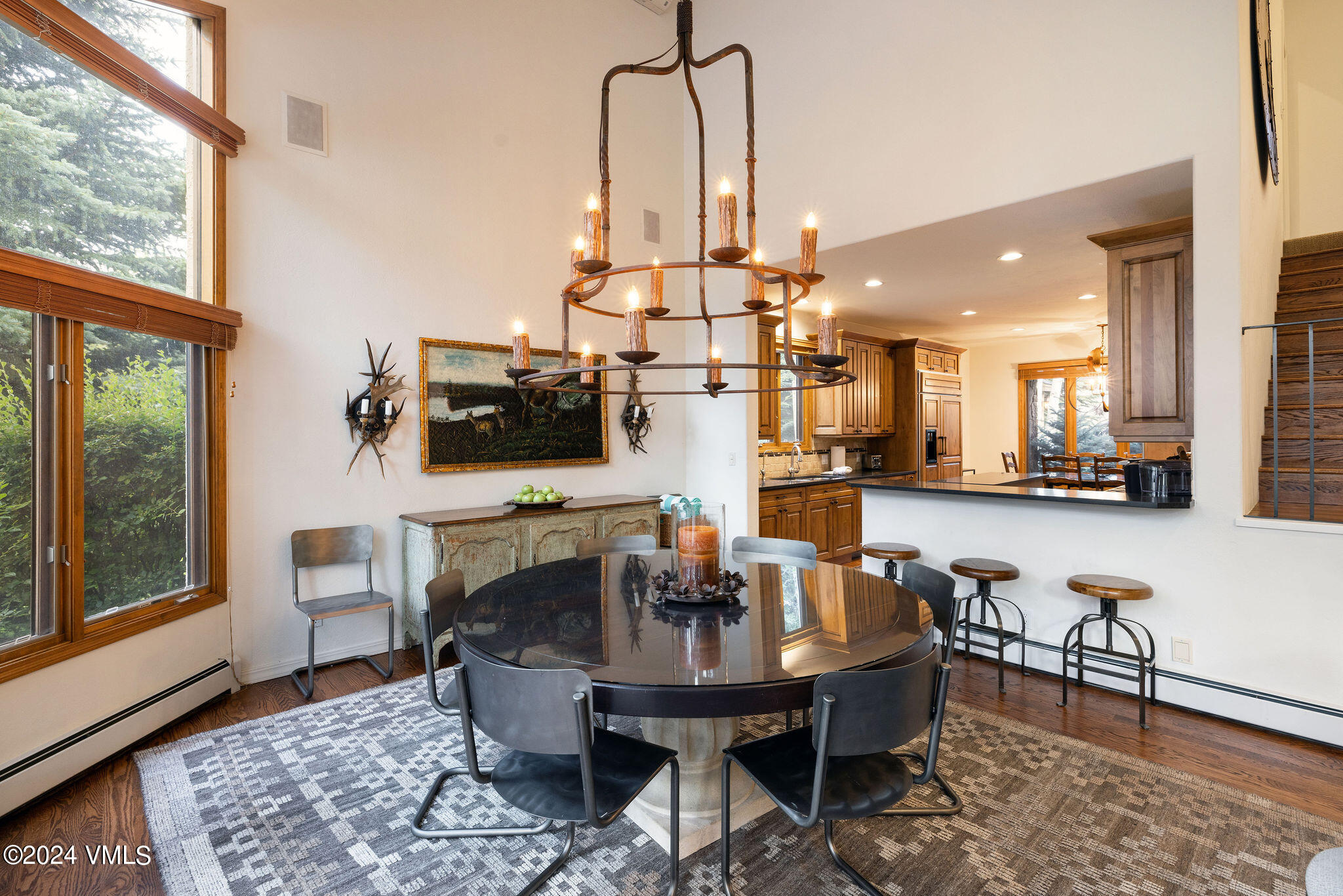 91 Ambleside Place Edwards, CO 81632 - Photo 7 of 28 a living room with furniture a flat screen tv and a large window