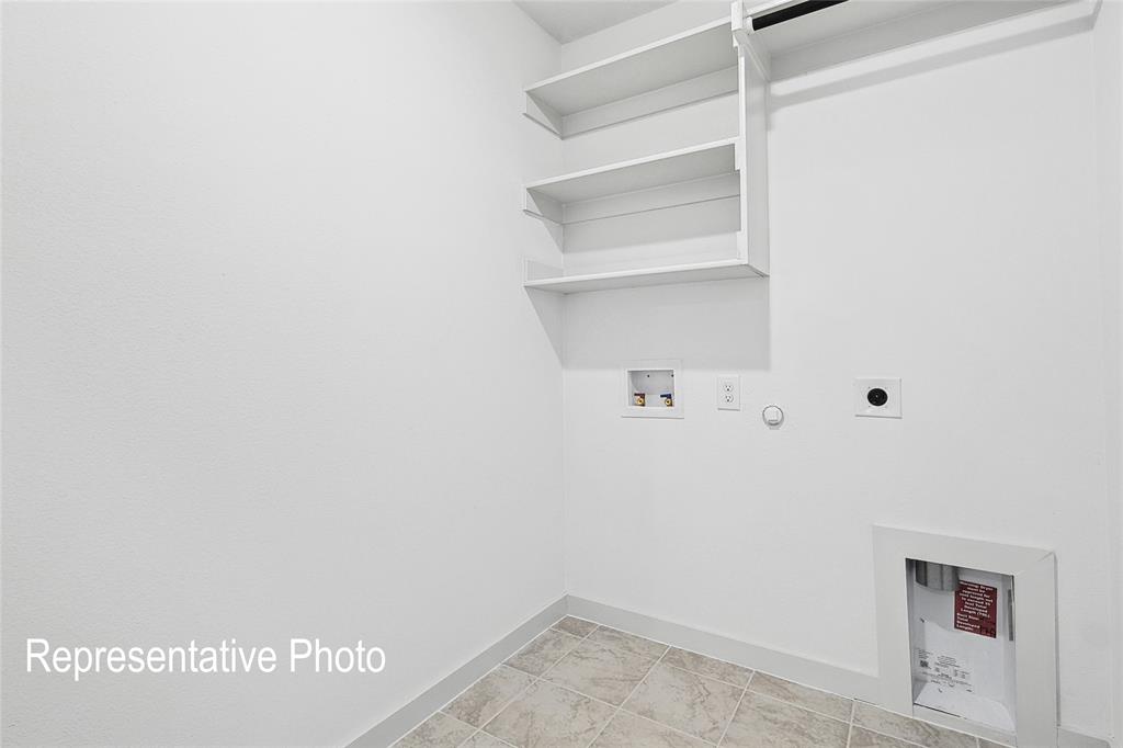 2709 Baker Farm Road Forney, TX 75126 - Photo 10 of 10 Dedicated utility space featuring built-in shelving, a clothes rod, and tile flooring