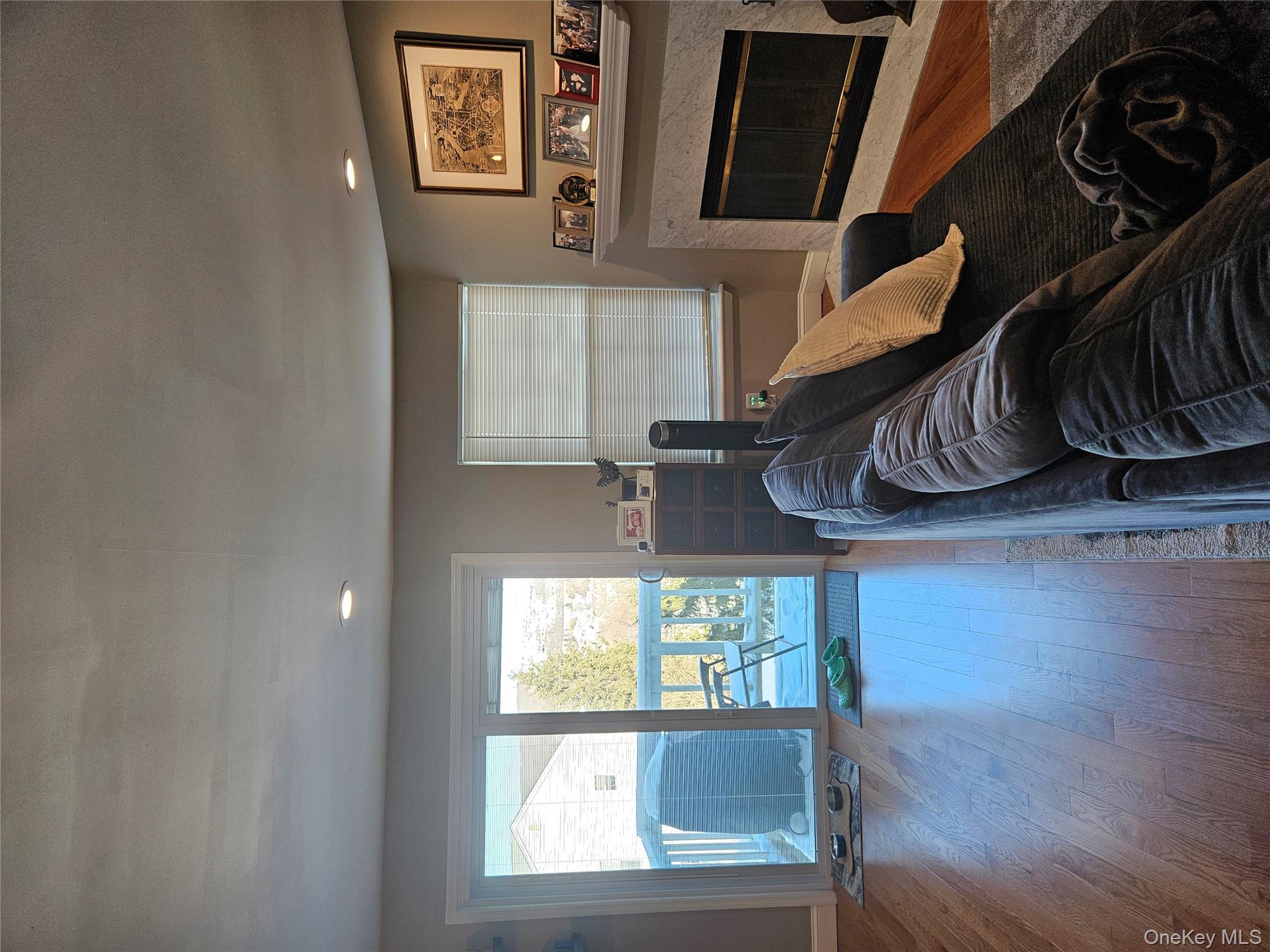20 Lexington Hills Road, Unit 10 Harriman, NY 10926 - Photo 12 of 17 Living room featuring a high end fireplace and wood-type flooring