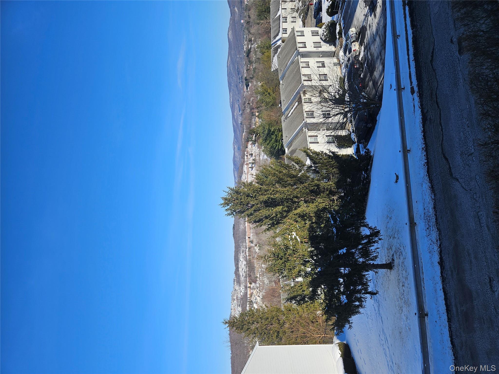 20 Lexington Hills Road, Unit 10 Harriman, NY 10926 - Photo 14 of 17 Snowy aerial view featuring a mountain view