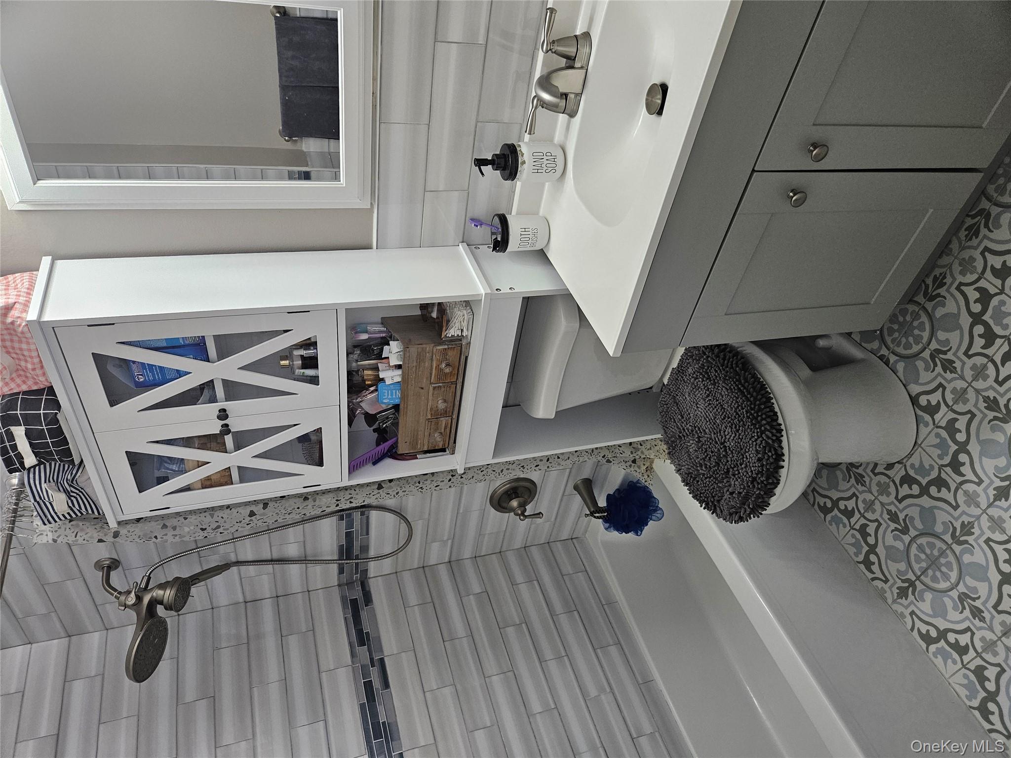 20 Lexington Hills Road, Unit 10 Harriman, NY 10926 - Photo 5 of 17 Full bathroom with tiled shower / bath combo, toilet, vanity, and tasteful backsplash