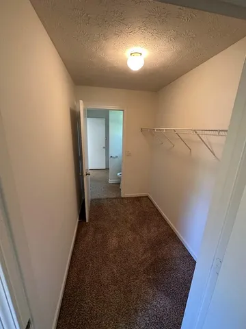 a view of a hallway to a room