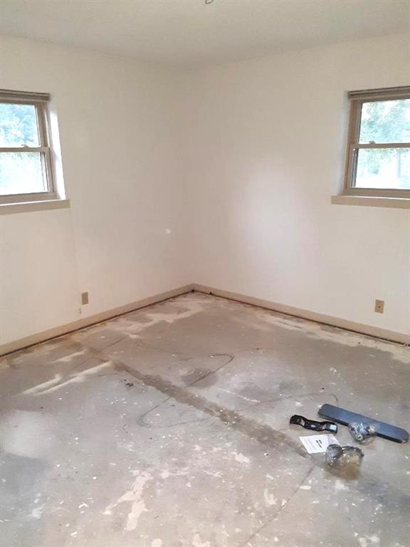 10495 Fm 346 Street West Flint, TX 75762 - Photo 13 of 19 an empty room with windows