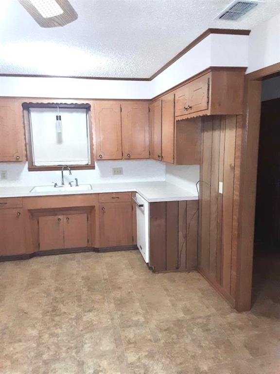 10495 Fm 346 Street West Flint, TX 75762 - Photo 9 of 19 a kitchen with stainless steel appliances a sink cabinets and a counter top space