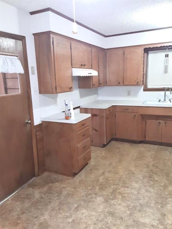10495 Fm 346 Street West Flint, TX 75762 - Photo 10 of 19 a kitchen with sink cabinets and window