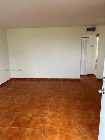 en empty room with an empty space and a window