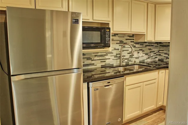 a white refrigerator freezer sitting in a kitchen