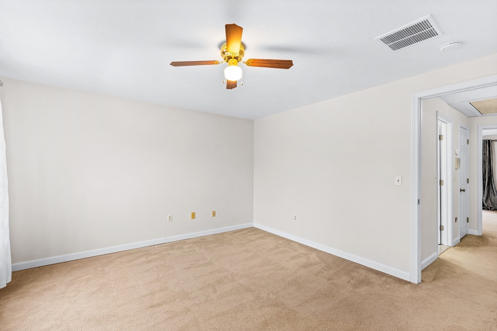 303 Ridgefield Circle, Unit B Clinton, MA 01510 - Photo 15 of 23 an empty room with a window