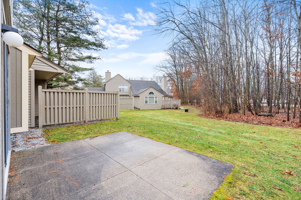 303 Ridgefield Circle, Unit B Clinton, MA 01510 - Photo 16 of 23 a view of a house with a yard and pathway
