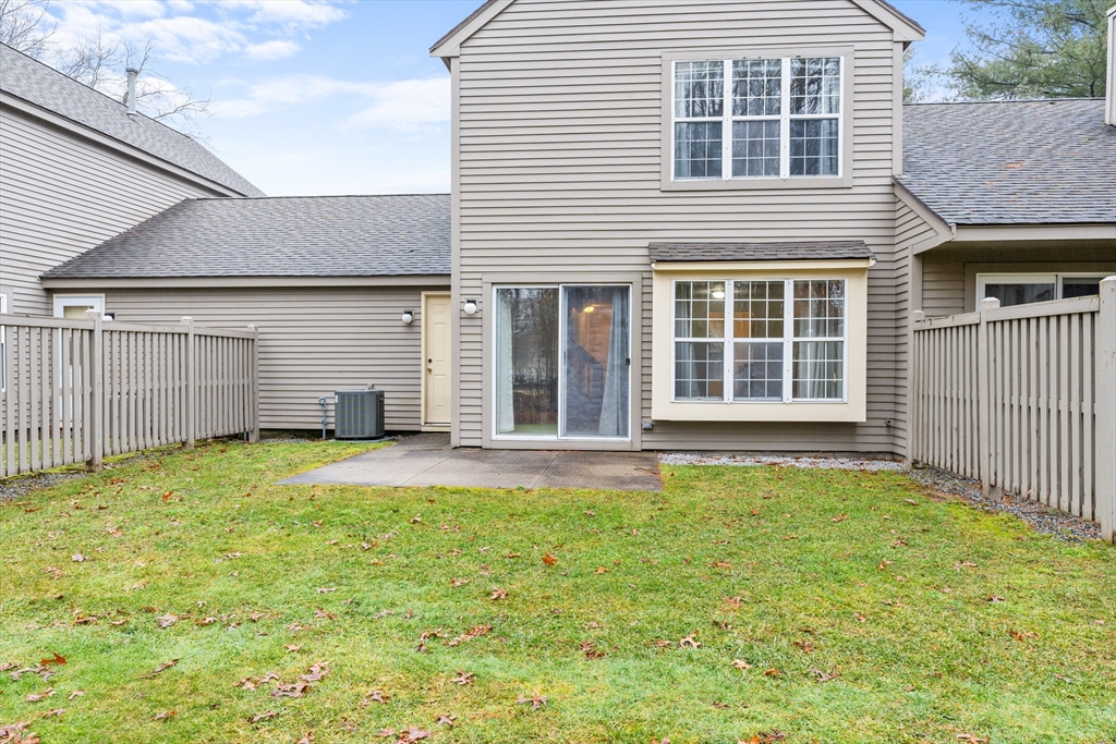 303 Ridgefield Circle, Unit B Clinton, MA 01510 - Photo 17 of 23 a house view with a garden space