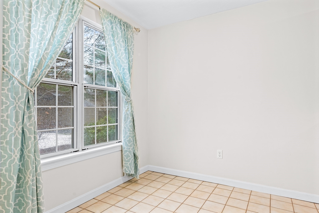 303 Ridgefield Circle, Unit B Clinton, MA 01510 - Photo 3 of 23 a view of an empty room with windows