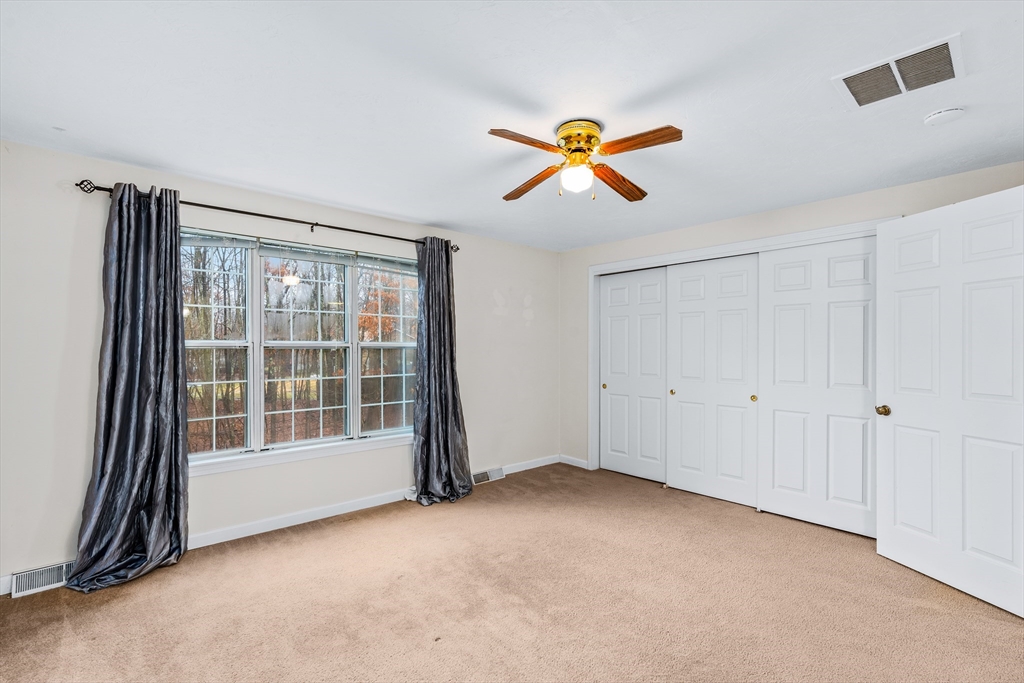 303 Ridgefield Circle, Unit B Clinton, MA 01510 - Photo 9 of 23 a view of an empty room with a window