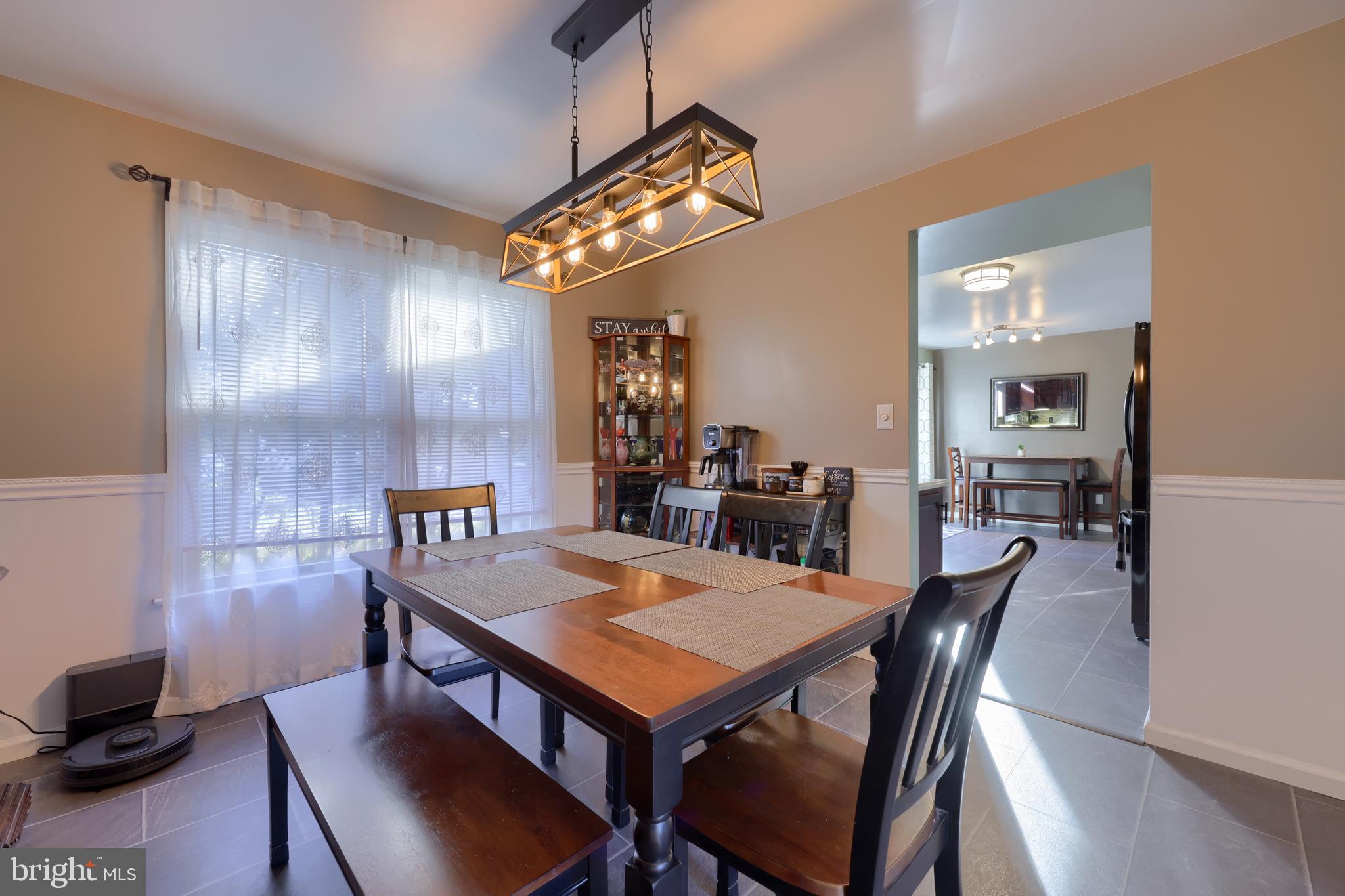 1022 Boeshore Circle Reading, PA 19605 - Photo 13 of 39 a view of a dining room with furniture and wooden floor