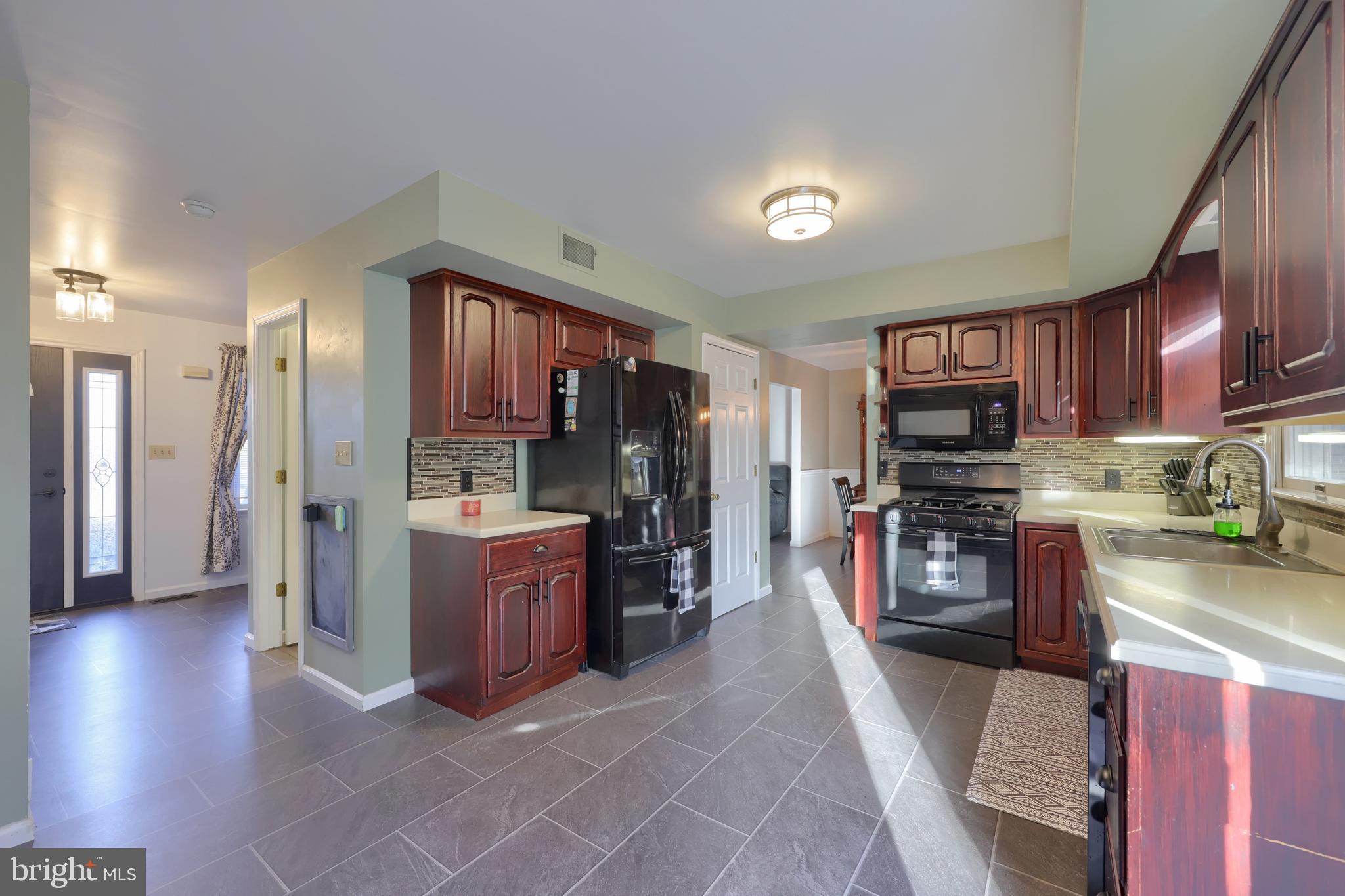 1022 Boeshore Circle Reading, PA 19605 - Photo 18 of 39 a kitchen with stainless steel appliances granite countertop a refrigerator stove and sink
