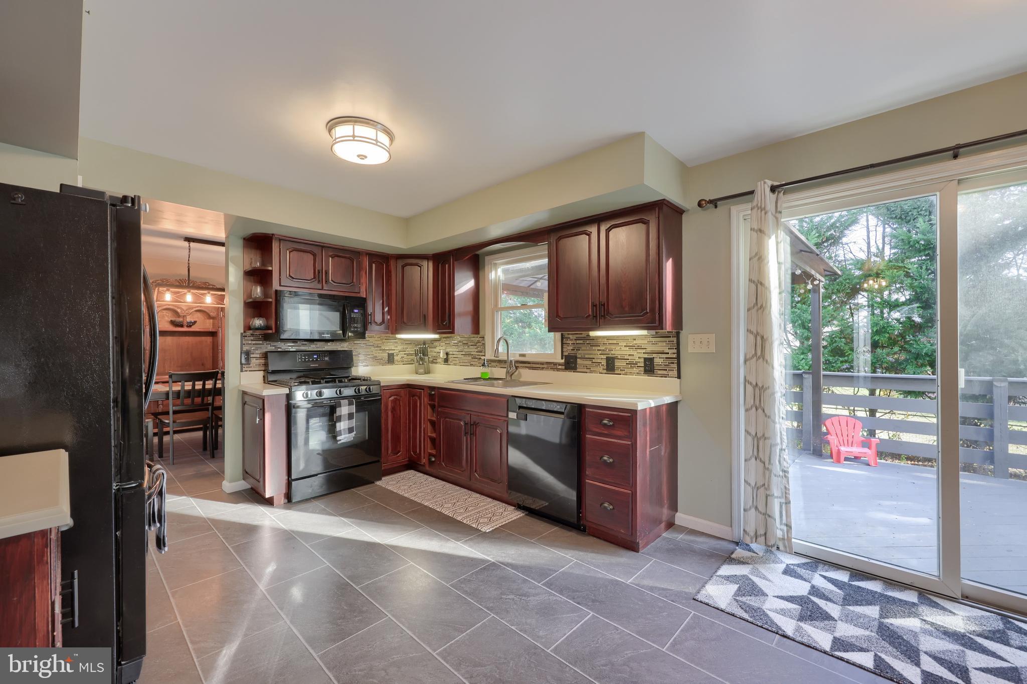 1022 Boeshore Circle Reading, PA 19605 - Photo 19 of 39 a kitchen with stainless steel appliances granite countertop a refrigerator and a stove top oven