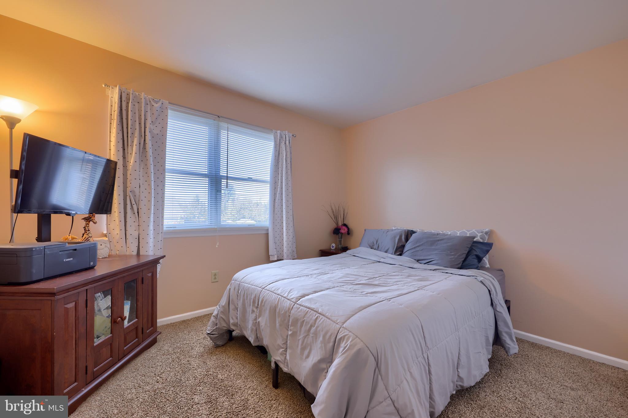 1022 Boeshore Circle Reading, PA 19605 - Photo 25 of 39 a bedroom with a bed window and dresser