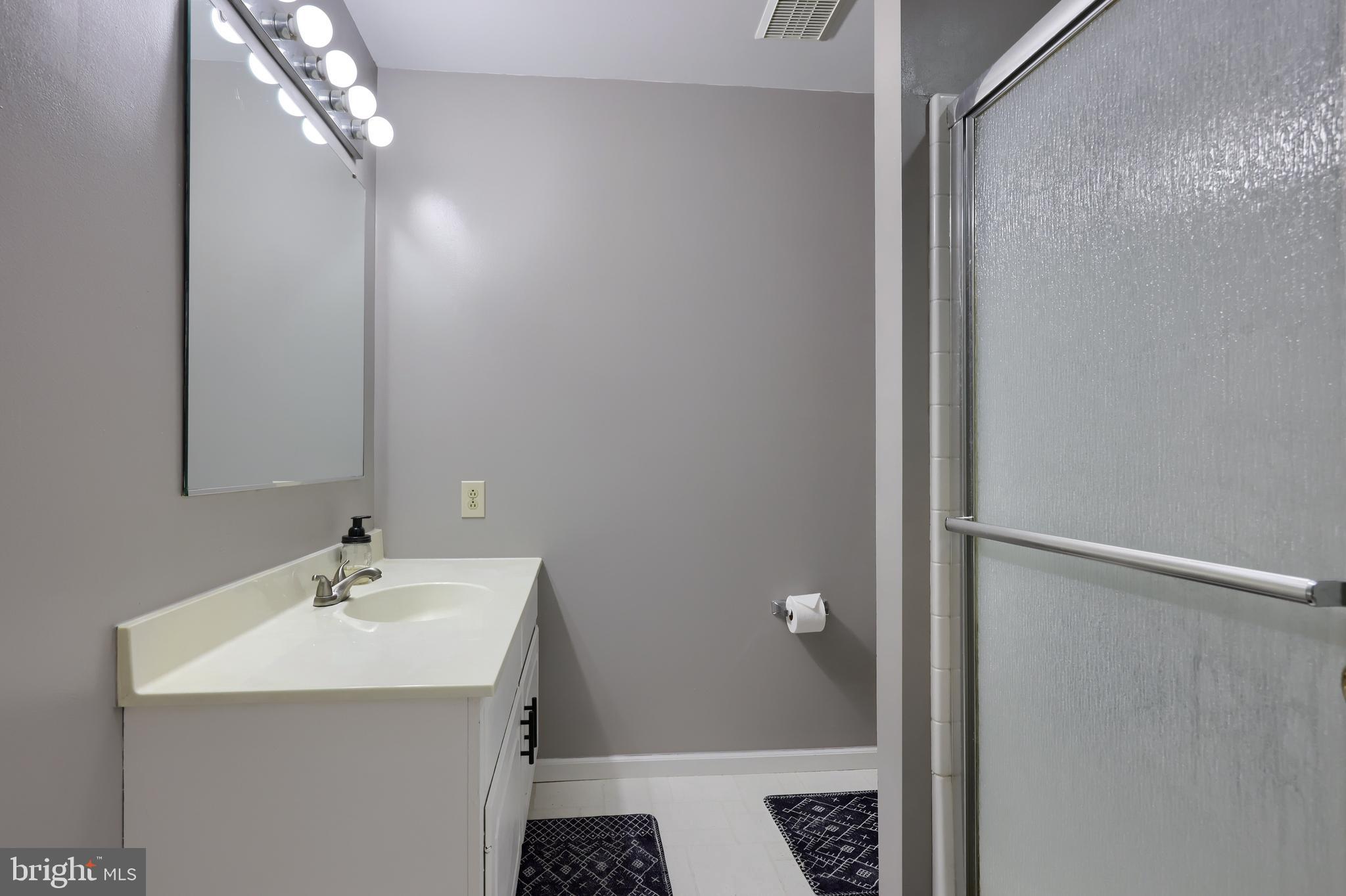 1022 Boeshore Circle Reading, PA 19605 - Photo 27 of 39 a bathroom with a sink a mirror and a toilet