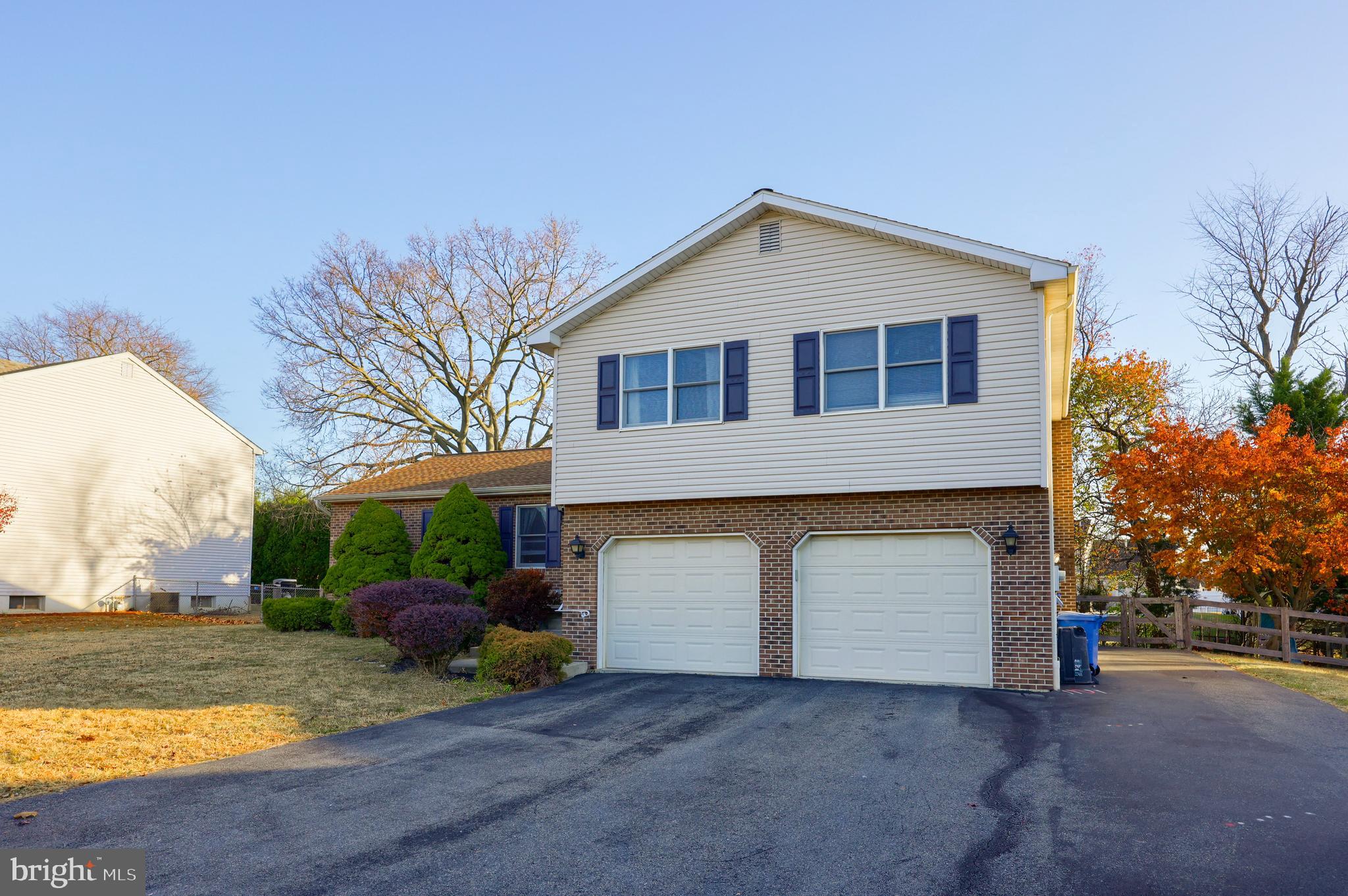 1022 Boeshore Circle Reading, PA 19605 - Photo 3 of 39 a front view of a house with a yard and garage